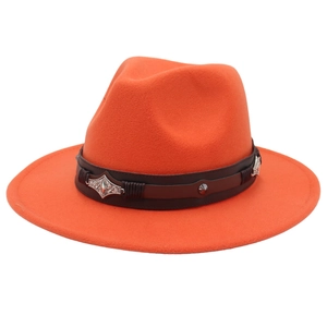 Close-up of orange wool felt fedora featuring a vintage brown leather band with metal studs