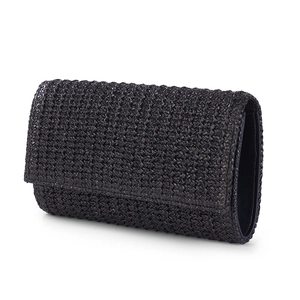 Close-up of black woven straw texture on fashion crossbody bag with studio lighting