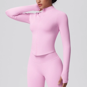 Detail view of pink yoga jacket with thumbholes and ergonomic ribbing textures