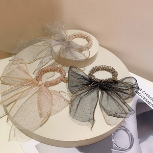 Detailed trio of mesh bow hair ties with glitter sequins in beige, grey, and black colors