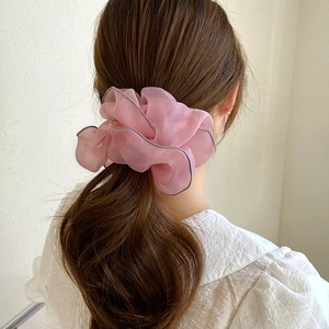 Pink sheer mesh scrunchie with grey trim edge shown in a stylish ponytail hairstyle