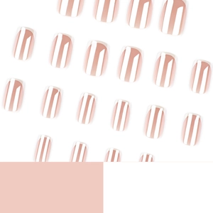 Glossy nude French press-on nails with white tips in a minimalist diagonal layout