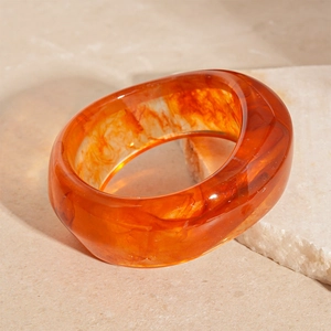Chic amber acrylic irregular wavy wide bangle with marble texture and translucent finish