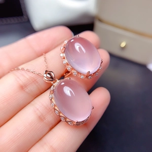 Rose quartz jewelry set with oval pendant necklace and open ring in rose gold finish