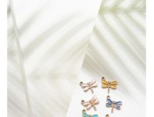 Macro view of colorful dragonfly alloy charms with glitter enamel for jewelry making