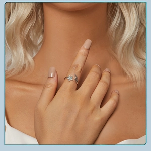 Close-up of a s925 silver flower ring with green petals worn on a model's finger