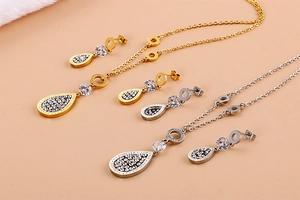 Detail of gold and silver leaf jewelry sets with Forever Love zircon engravings
