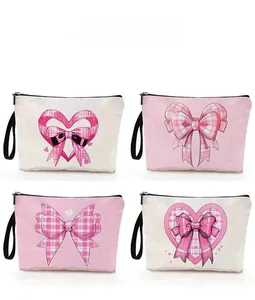 Detailed pattern display of pink heart and plaid bow cosmetic bags with black handles