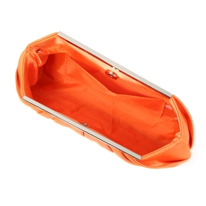 Top view of orange satin evening clutch showing interior lining and silver metal frame