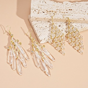 Elegant gold drop earrings with transparent crystal fringe and teardrop acrylic pendants