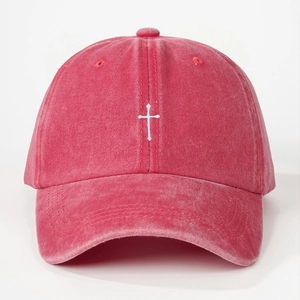 Vintage washed pink cotton baseball cap with white cross embroidery and curved brim