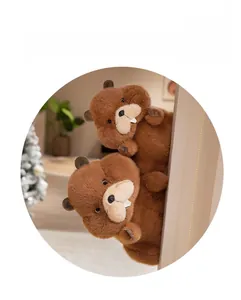 Close-up of two cute marmot plush toys with soft brown fur and iconic white front teeth