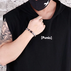 Close-up of a men's layered steel mesh bracelet with black rope and hexagon link detail