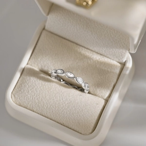 Macro shot of S925 sterling silver ring with marquise-cut zircons in a jewelry box