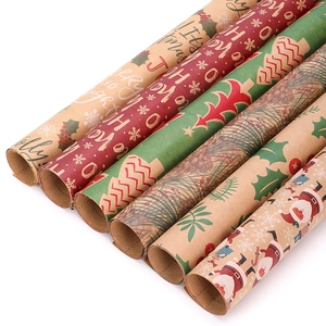 Assorted Christmas kraft wrapping paper rolls with festive red, green and snowflake patterns