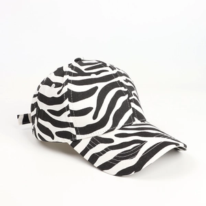 Detail of a black and white zebra pattern baseball cap with high-quality fabric texture