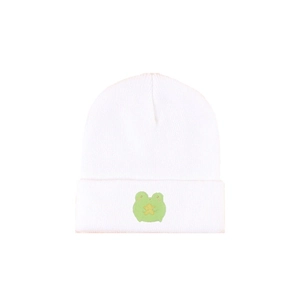 White knitted beanie with green frog embroidery flat lay on a white background