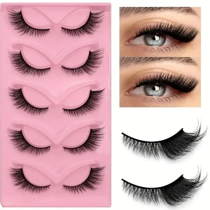 Dramatic cat-eye false eyelashes with a thick black band and flared outer corners in a box