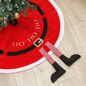 Red Christmas tree skirt with white fur trim, belt decor, and elf legs on wood floor