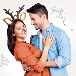 Brown reindeer antler headband with gold spots shown on a model for Christmas