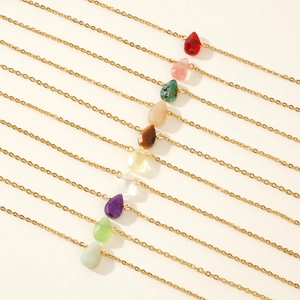 Set of ten gold stainless steel necklaces featuring colorful teardrop gemstones for women