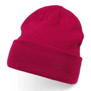 Close-up detail of magenta knitted beanie showing fine rib-stitch texture and folded cuff