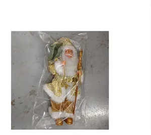 Standing Santa Claus doll in gold floral robe with white fur trim in packaging