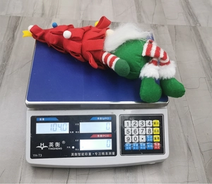Christmas faceless gnome doll with long legs in festive red and green weighing 104 grams