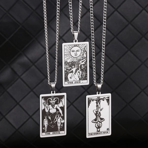 Stainless steel tarot card necklaces featuring The Sun, The Devil, and The Hanged Man