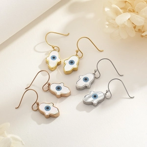 Three pairs of Hamsa hand evil eye earrings in gold, silver and rose gold metal finishes