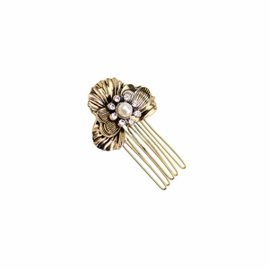 Detailed view of vintage gold flower hair comb with pearl inlay and crystal rhinestones