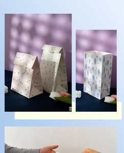 Detail of cartoon paper gift bags with tulip patterns and Sweet Days decorative seals