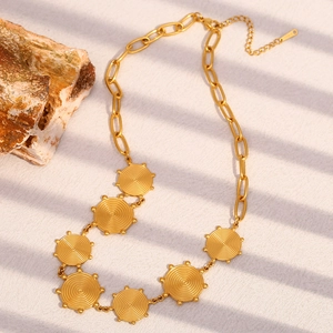 Retro gold stainless steel necklace featuring bold textured spiral circular pendants