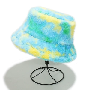 Macro shot of colorful tie-dye faux fur texture on a warm winter bucket hat for women