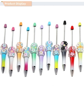 Detail view of 12 colorful gradient DIY beaded pens with 3D floral and rhinestone accents