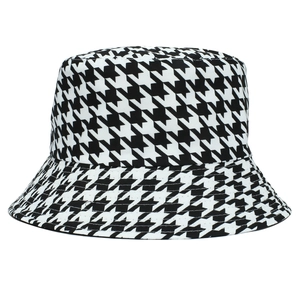 Detailed close-up of the black and white houndstooth pattern on the bucket hat