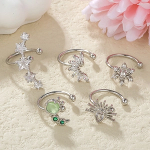 Five-piece silver ear cuff set with star, snowflake, and leaf designs for non-pierced ears