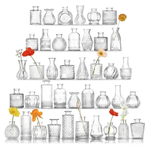 Set of 40 small transparent glass vases in various embossed styles for home decoration