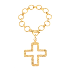 Detail of gold chain necklace featuring textured cross pendant and toggle clasp closure