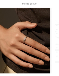 Detailed close-up of a wavy S925 silver bubble ring with five sparkling moissanite stones