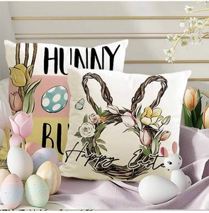 Detail of linen Easter pillow covers featuring Happy Easter and Bunny floral prints