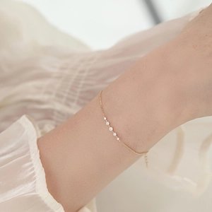 Armband aus 925er Sterlingsilber mit 14k Goldbeschichtung und fünf runden Zirkonia