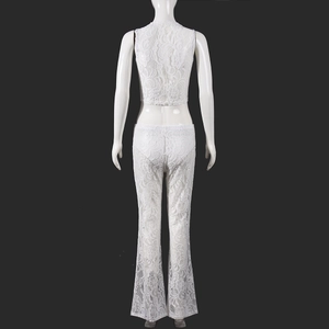 Back view of a white lace two-piece set featuring crop top and slim-fit trousers