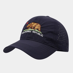 Detail view of California Republic bear embroidery and laser-cut vents on navy baseball cap