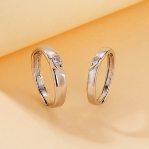 Detail of adjustable couple rings with silver finish and sparkling center cubic zirconia