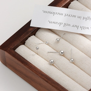 Set of 6 minimalist S925 sterling silver ball stud earrings in various sizes on a wood box