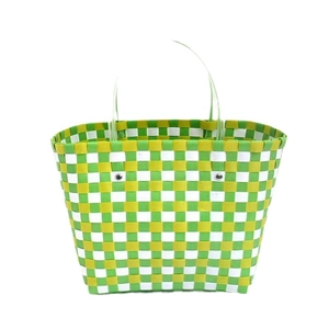 Handwoven colorful checkered plastic tote bag with transparent round handles and silver rivets