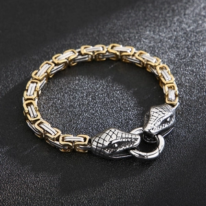 Detail of two-tone Byzantine chain with double snake head clasps in gold and silver