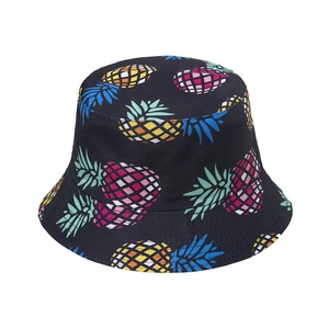 Close-up of tropical pineapple print and reinforced stitching on a black cotton bucket hat