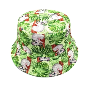 Close-up of high-quality canvas bucket hat featuring green koala and tropical leaf prints